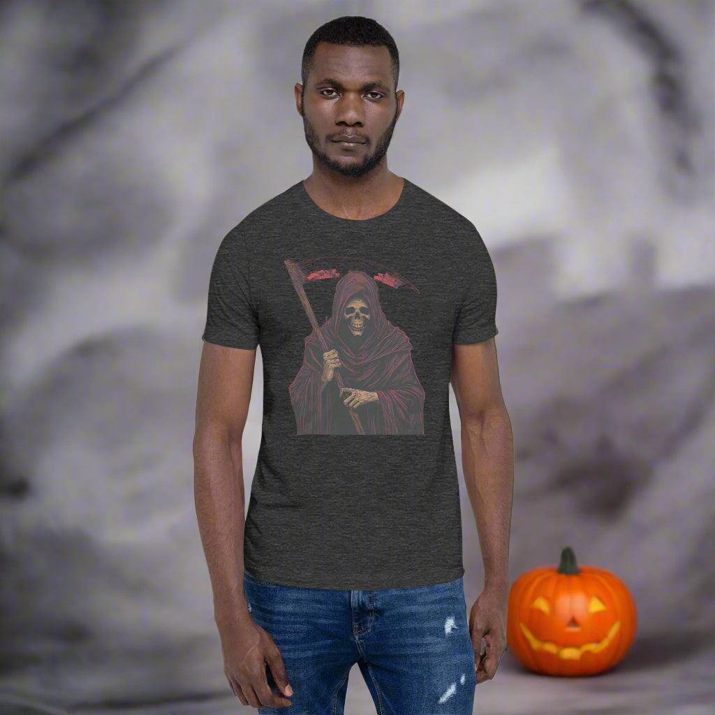 Man wearing a dark gray t-shirt with a graphic design of a hooded figure holding a scythe on a white background.