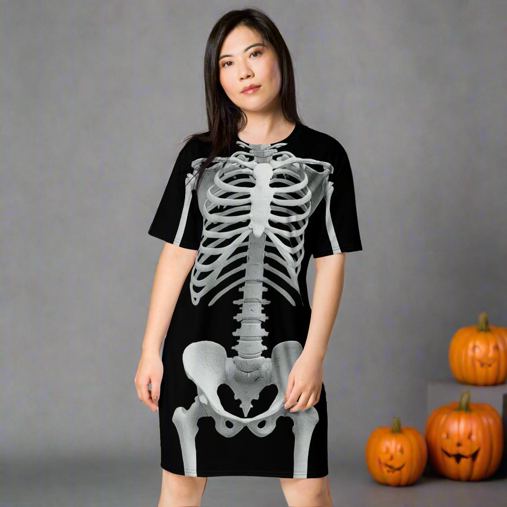 Woman wearing a black dress with a skeleton design on a white background