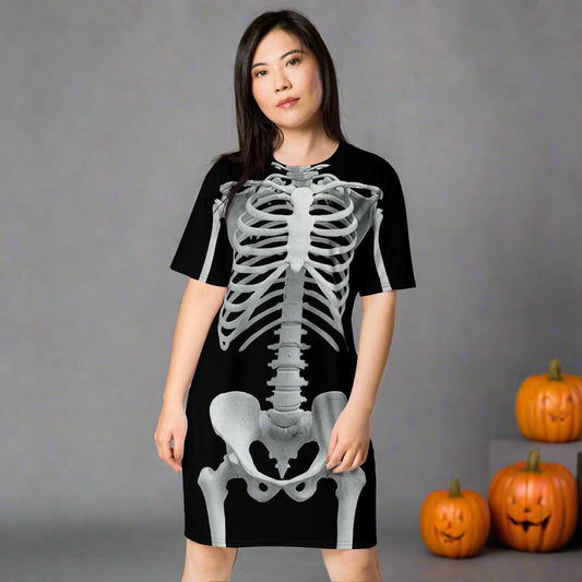 Woman wearing a black dress with a skeleton design on a white background
